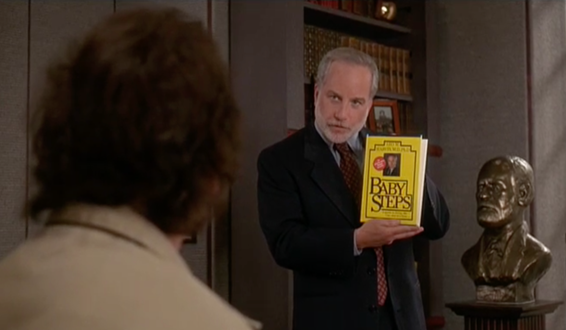 Dr. Leo Marvin (Richard Dreyfuss) describes his book Baby Steps to Bob Wiley (Bill Murray).