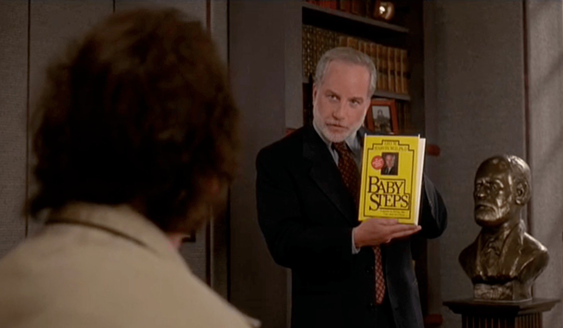 Dr. Leo Marvin (Richard Dreyfuss) describes his book Baby Steps to Bob Wiley (Bill Murray).